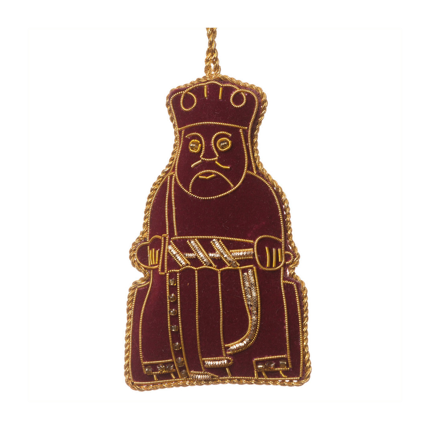 An embroidered hanging decoration of a king Lewis chess piece. The decoration is made form maroon felt and embroidered with gold thread detailing.