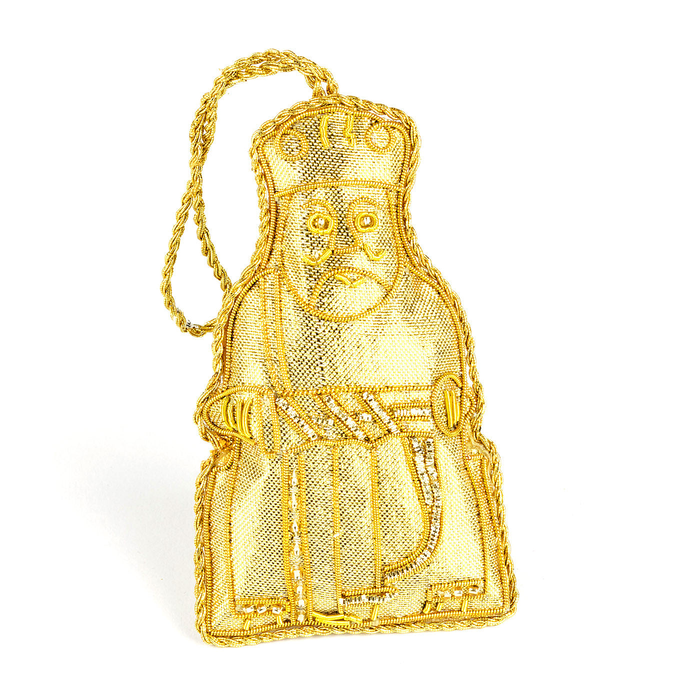 An embroidered hanging decoration of a king Lewis chess piece. The decoration is made from shiny gold fabric and embroidered with gold thread detailing.