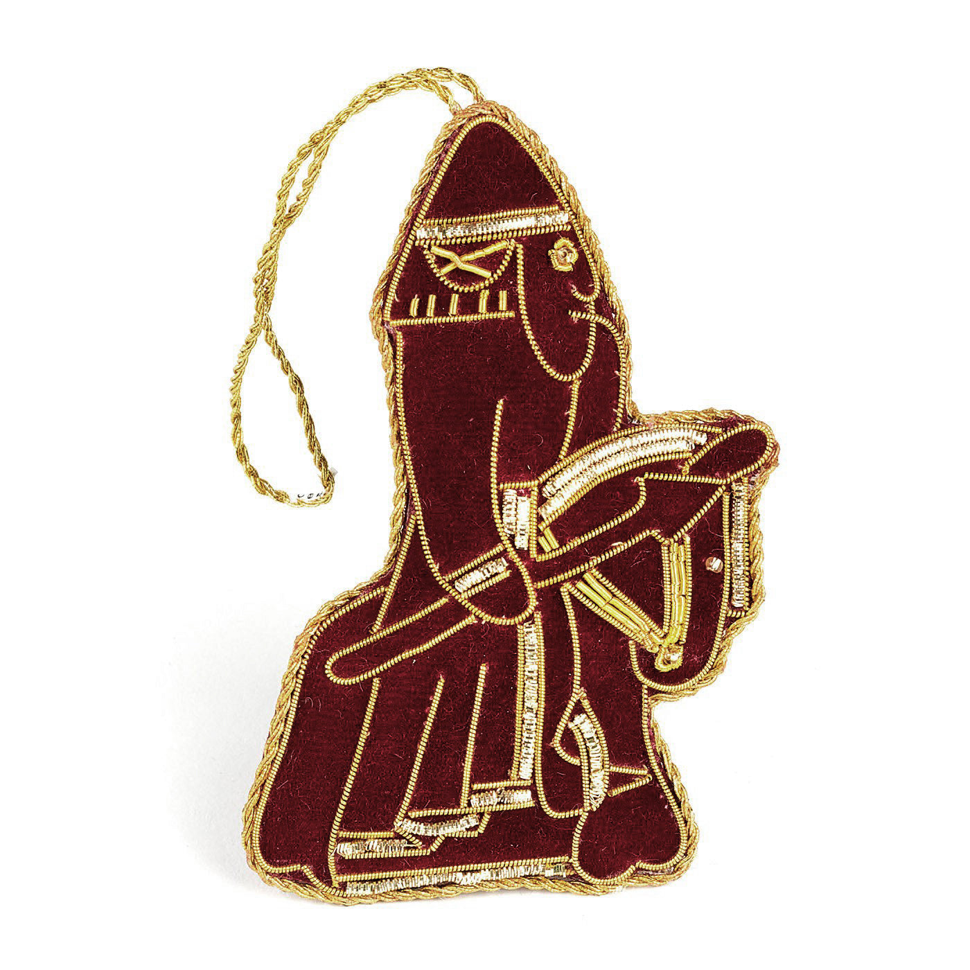 An embroidered hanging decoration of a knight Lewis chess piece. The decoration is made from maroon felt and embroidered with gold thread detailing.
