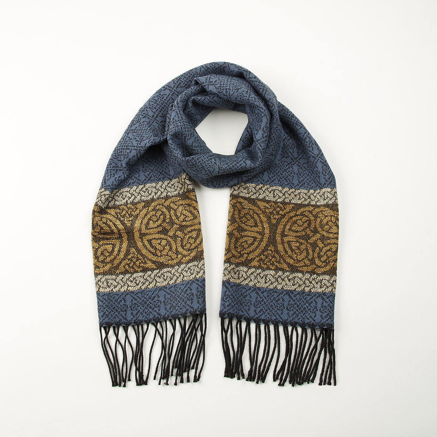 Blue tassled scarf with a celtic roundal pattern against a plain white background.