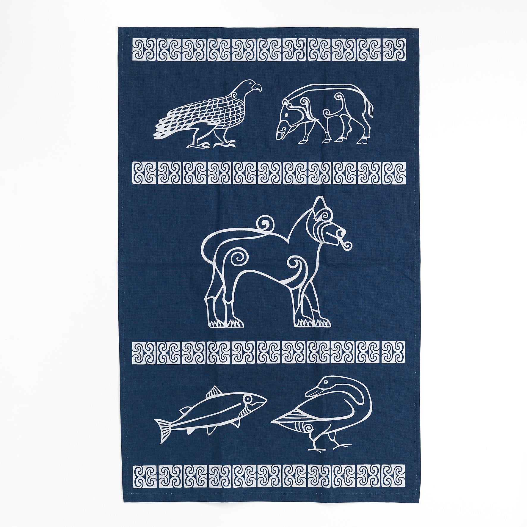 a navy blue cotton tea towel with silver detailing taken from Pictish carvings. across the tea towel are four strips of Pictish pattern work creating three segments of the towel with animal designs also taken from carvings. In the top segment there is an eagle and a boar, in the middle segment there is a large lion, and in the bottom segment there is a fish and a goose.