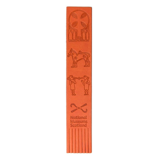 An orange faux leather bookmark with three embossed designs taken from Pictish carvings. The top design is of some Pictish pattern work, the middle design is of a lion and the bottom design is of two figures with beaks and bird legs. The bottom of the bookmark underneath the designs has the National Museums Scotland logo embossed and cuts in the bookmark to form tassles.