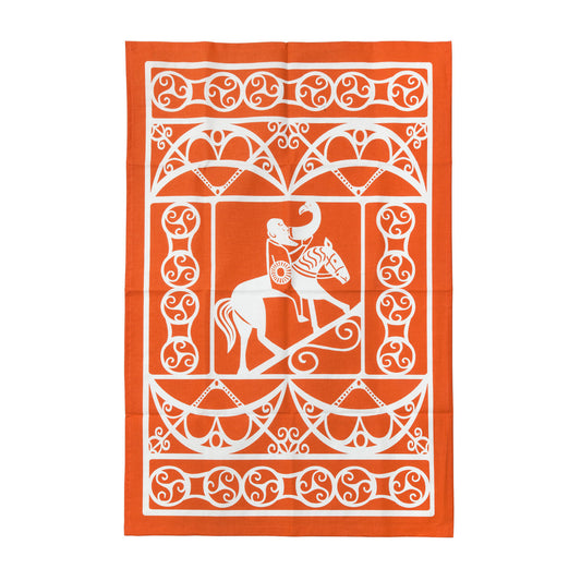 An orange cotton tea towel with a white design taken from a Pictish carving of a man drinking whilst riding a horse surrounded by pattern work.