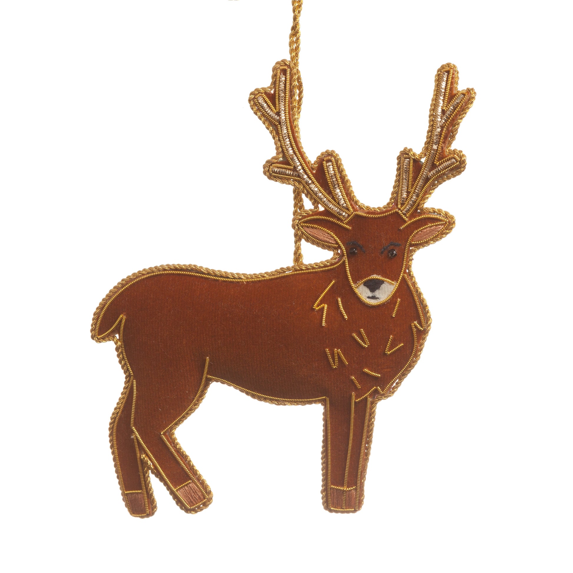 An embroidered hanging decoration of a Scottish stag. The decoration is made from brown fabric and is embroidered with a gold thread.