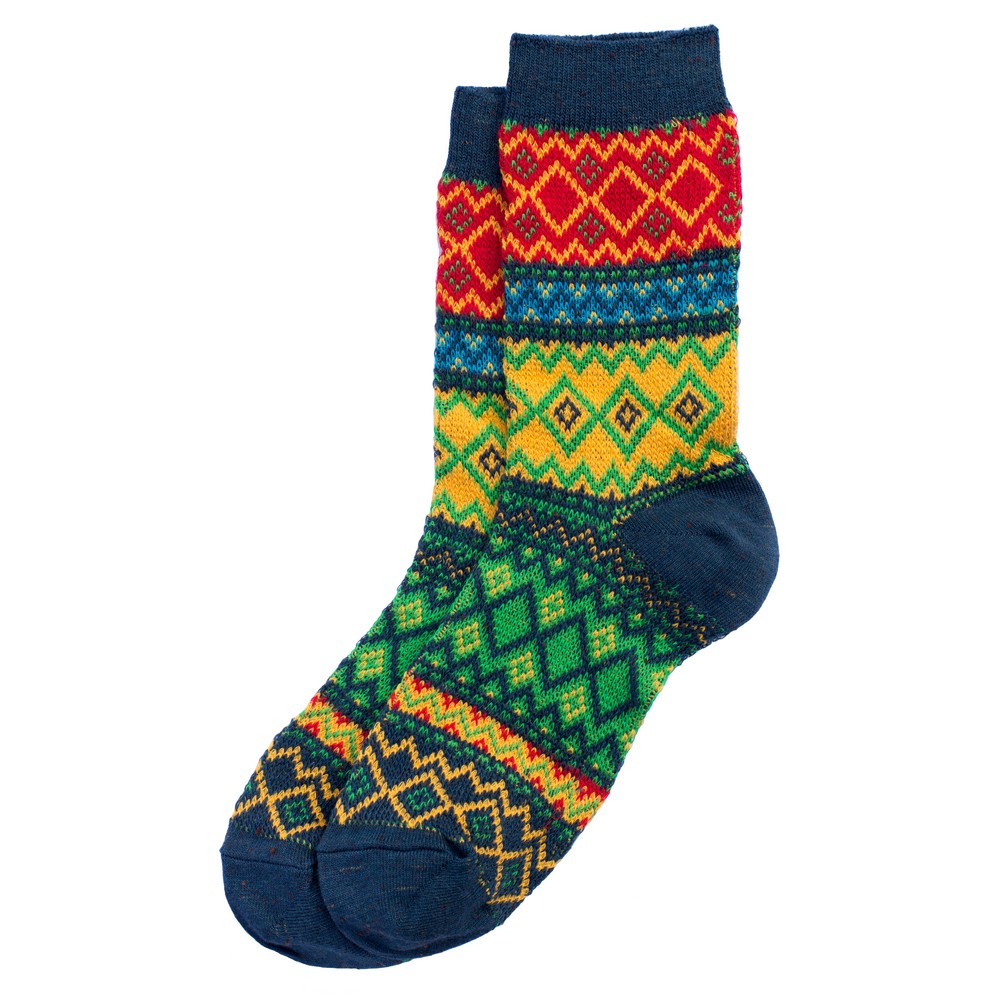 A pair of socks with a red, yellow and green fair isle like pattern against a white background.