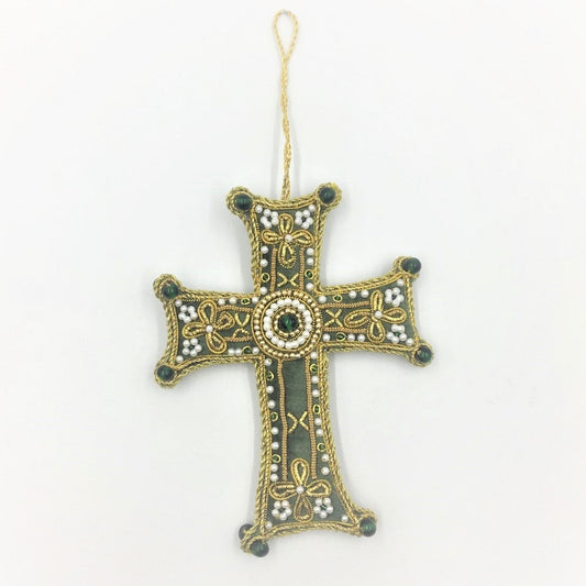 An embroidered decoration of a celtic cross. The decoration is made from a soft green fabric and embroidered with gold detailing and white and green beads.