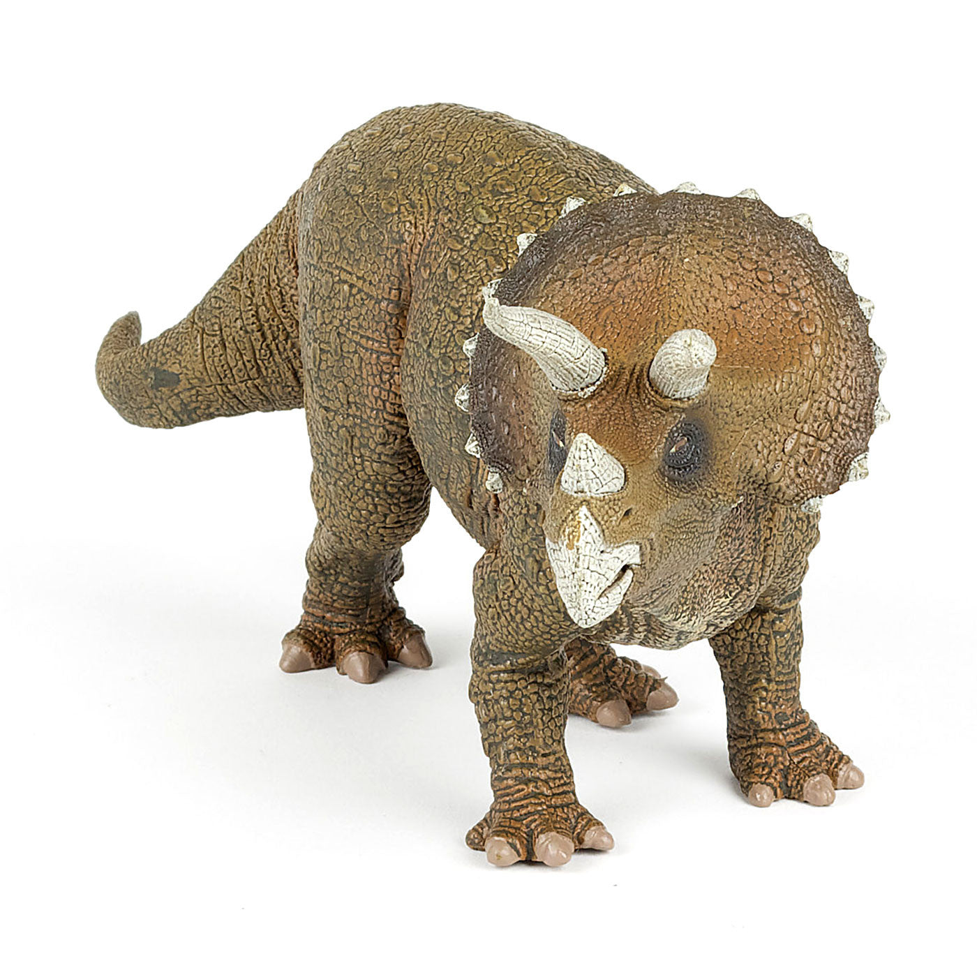 A brown toy triceratops with grey horns against a plain white background. The triceratops is looking towards the camera with it's tail flowing behind it.