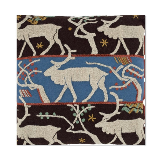 A square Christmas card with a photograph of a woolen material cushion embroidered with coloured woolen threads in satin and stem stitch and showing reindeer and trees on three bands.