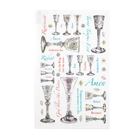 A white cotton tea towel with illustrations of Jacobite era goblets and phrases printed in an irregular pattern.