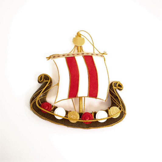 An embroidered hanging decoration of a viking long ship. The decoration is made from brown, red, and white fabric and is embroidered with gold thread.
